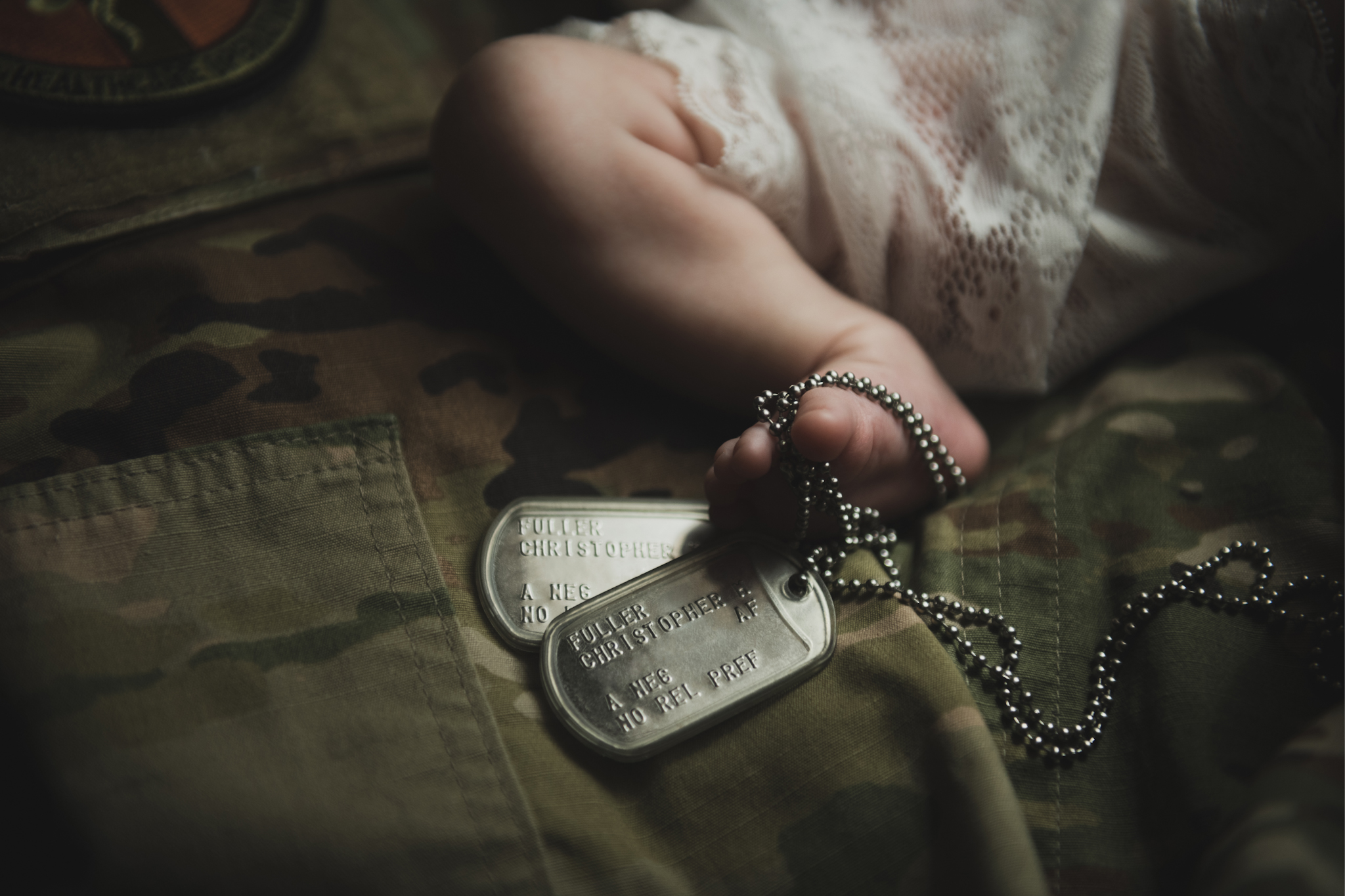 light and airy shoots of a marine baby shot on the air force base in southern california. Baby looks happy in her shoot with the high deserts best child photographer