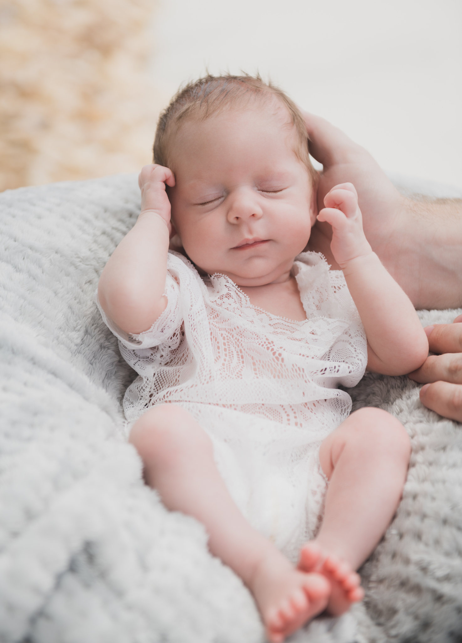light and airy shoots of a marine baby shot on the air force base in southern california. Baby looks happy in her shoot with the high deserts best child photographer