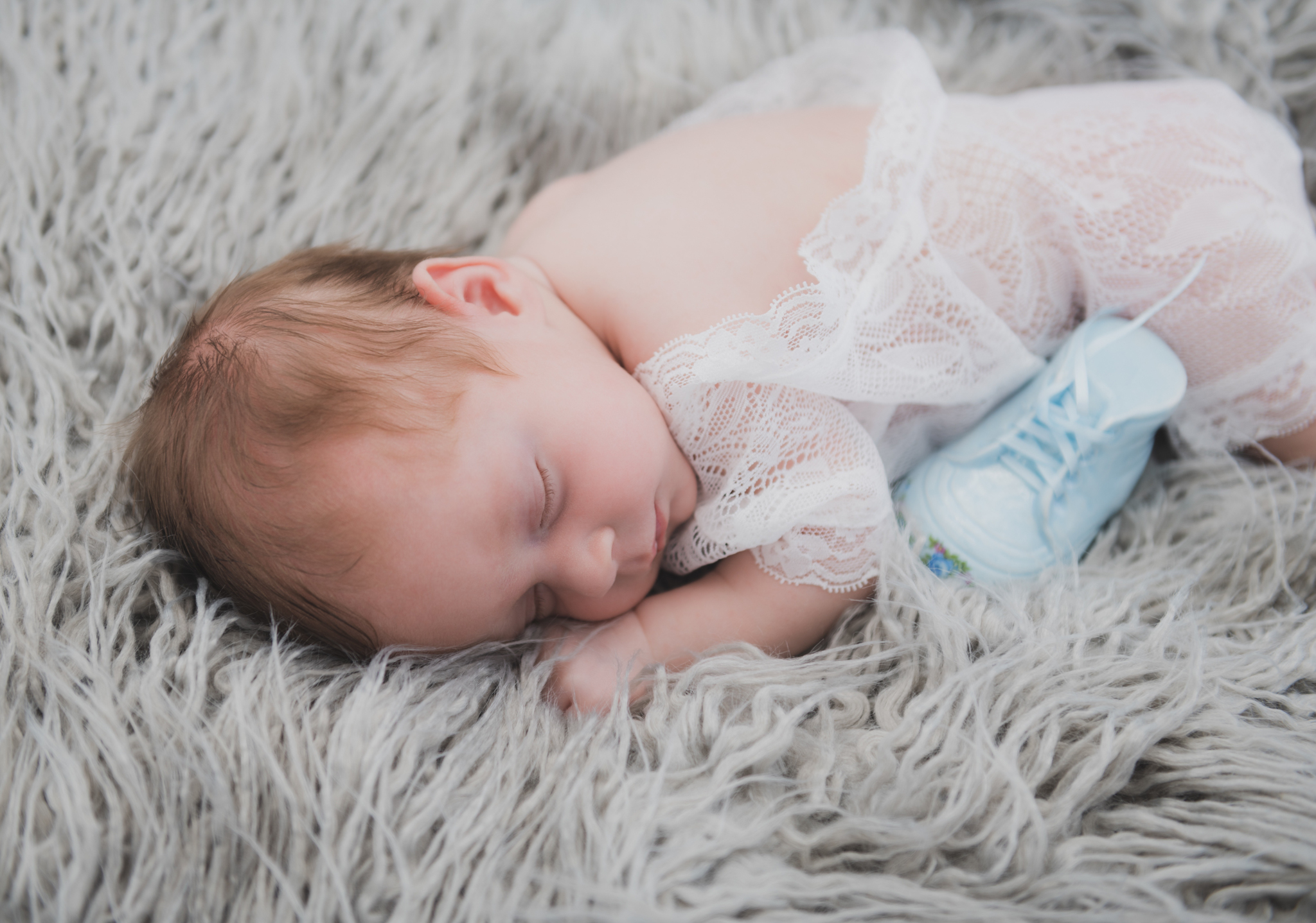 light and airy shoots of a marine baby shot on the air force base in southern california. Baby looks happy in her shoot with the high deserts best child photographer