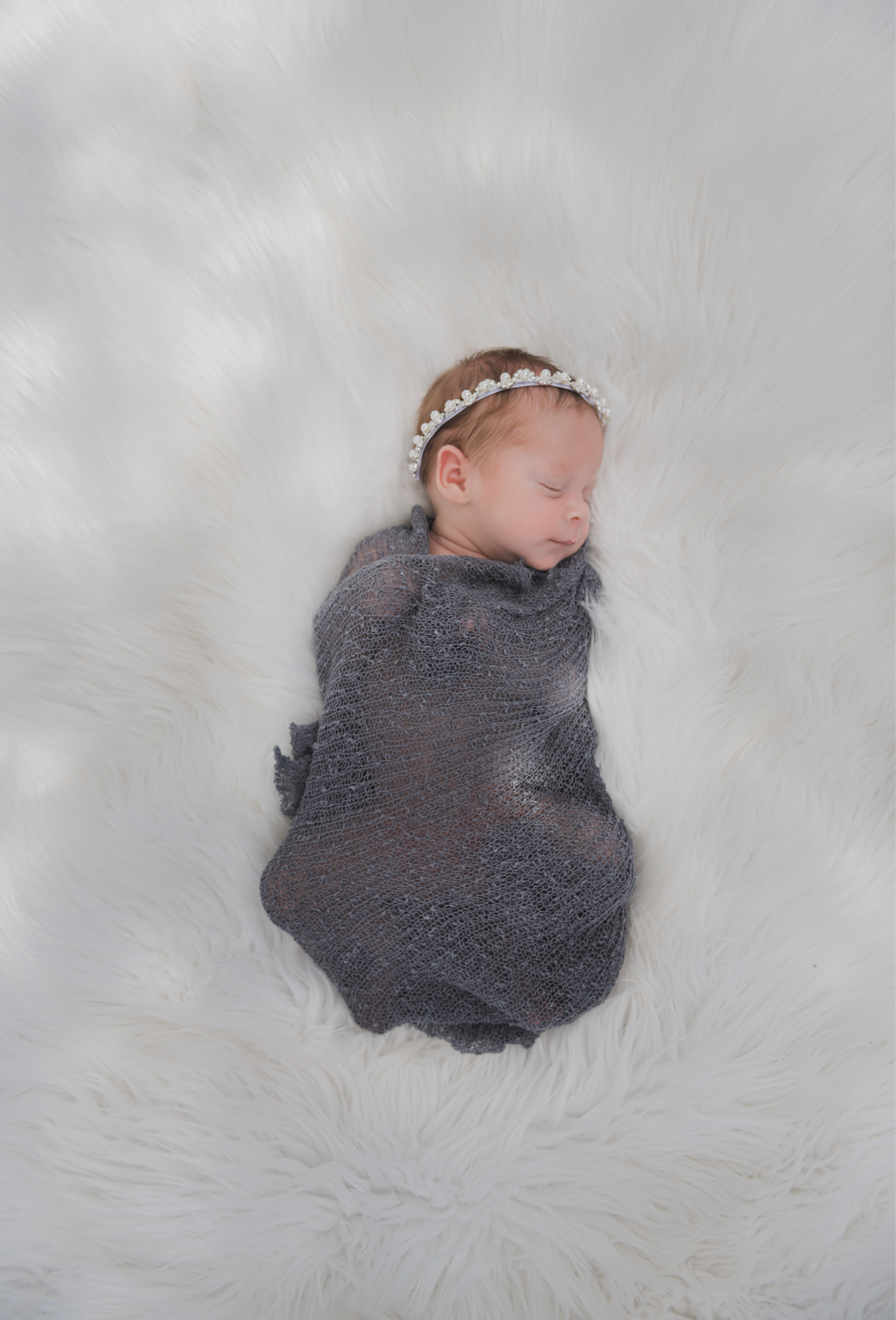 light and airy shoots of a marine baby shot on the air force base in southern california. Baby looks happy in her shoot with the high deserts best child photographer