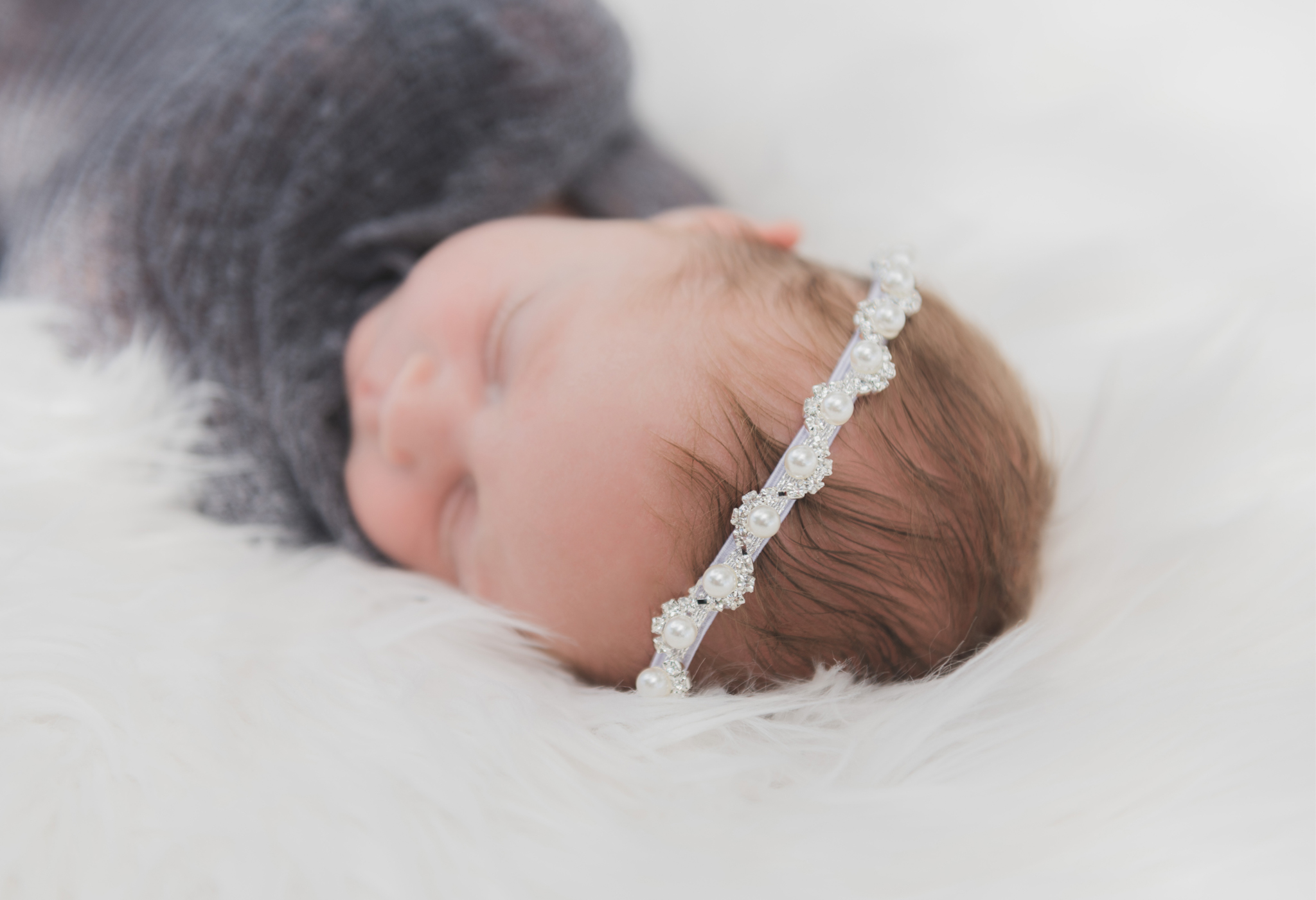 light and airy shoots of a marine baby shot on the air force base in southern california. Baby looks happy in her shoot with the high deserts best child photographer